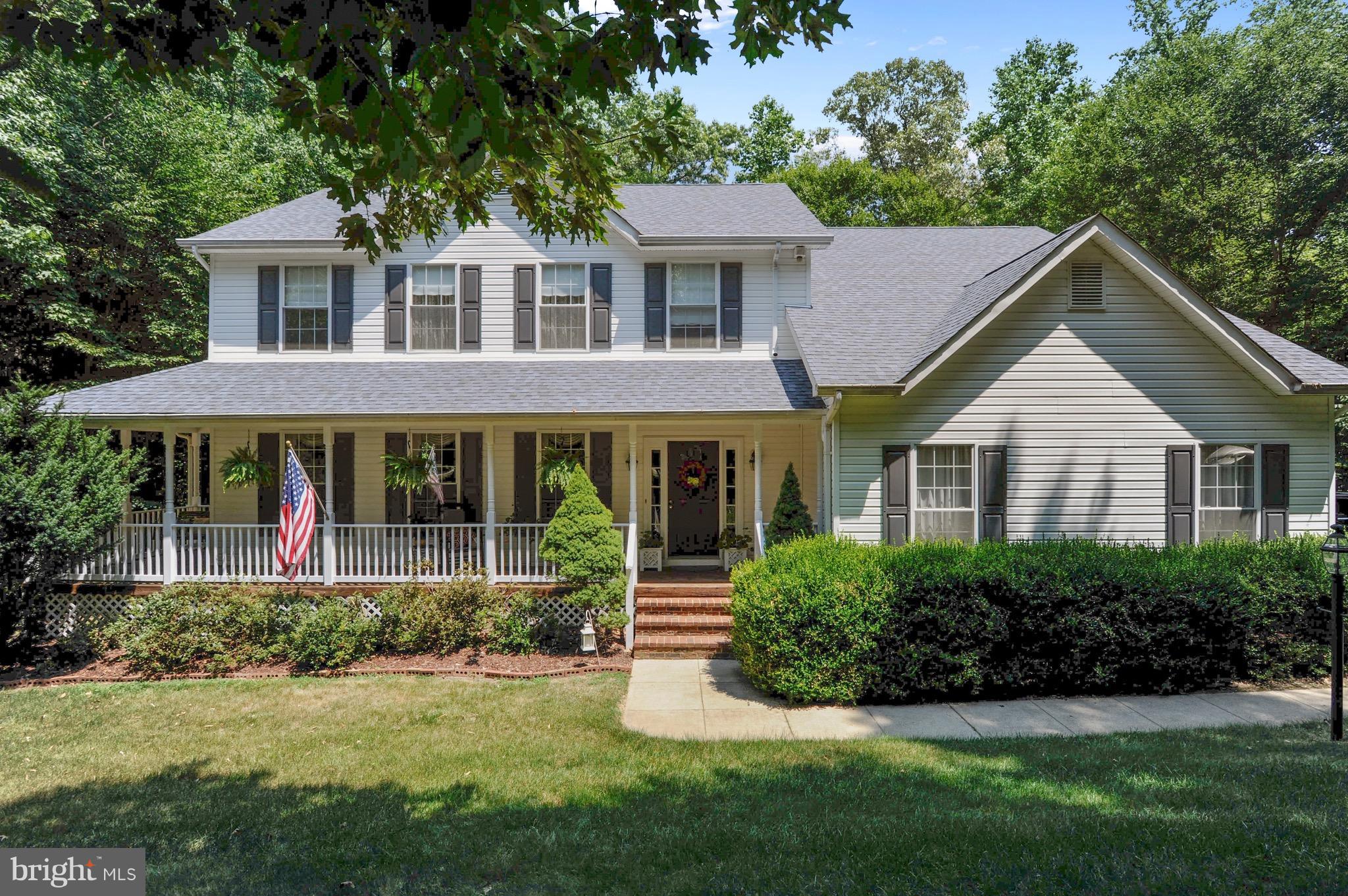 885 Carson Road Huntingtown, MD 20639 - Photo 1 of 30 a front view of a house with a yard and porch