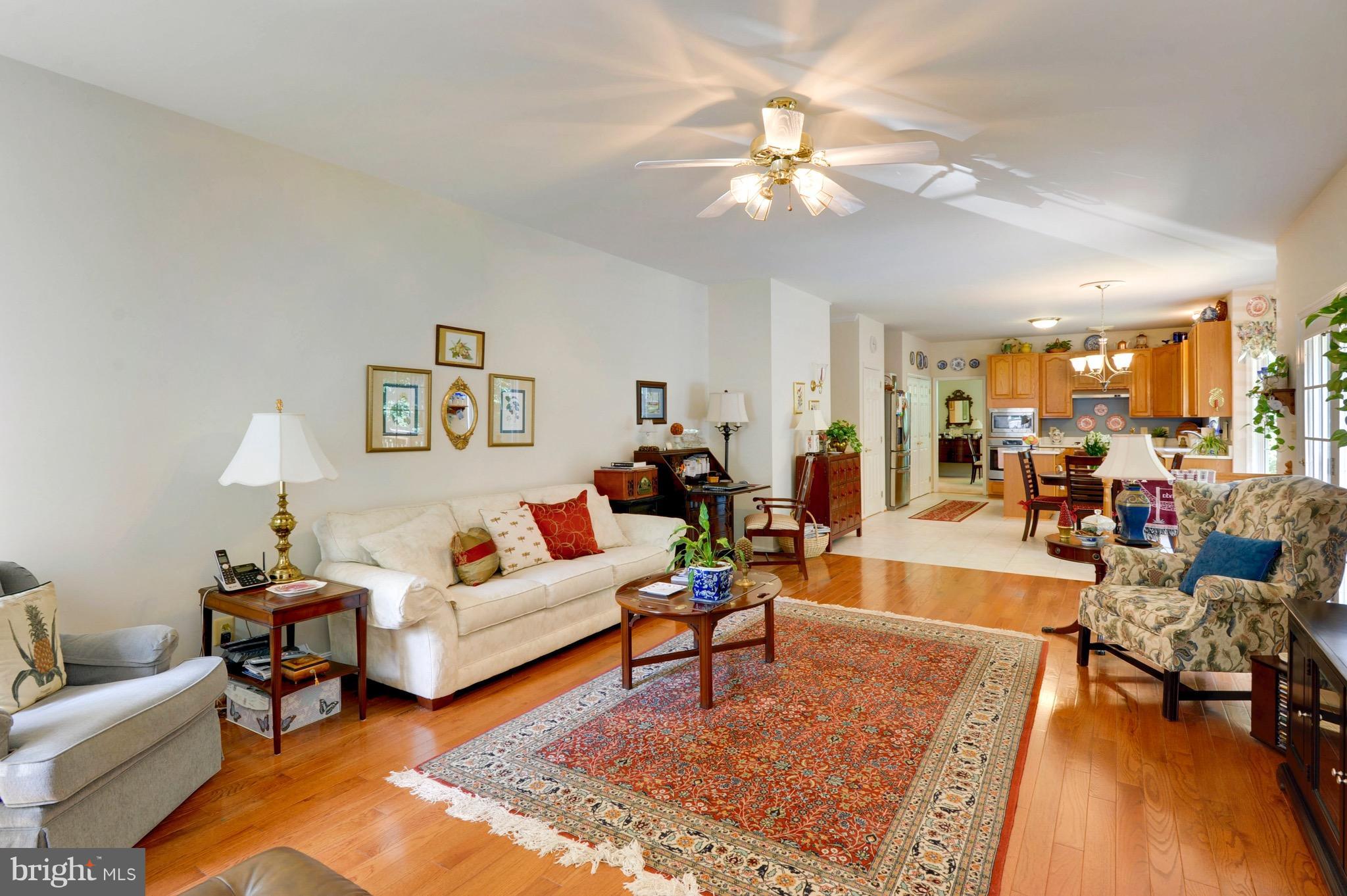885 Carson Road Huntingtown, MD 20639 - Photo 11 of 30 a living room with furniture and a chandelier