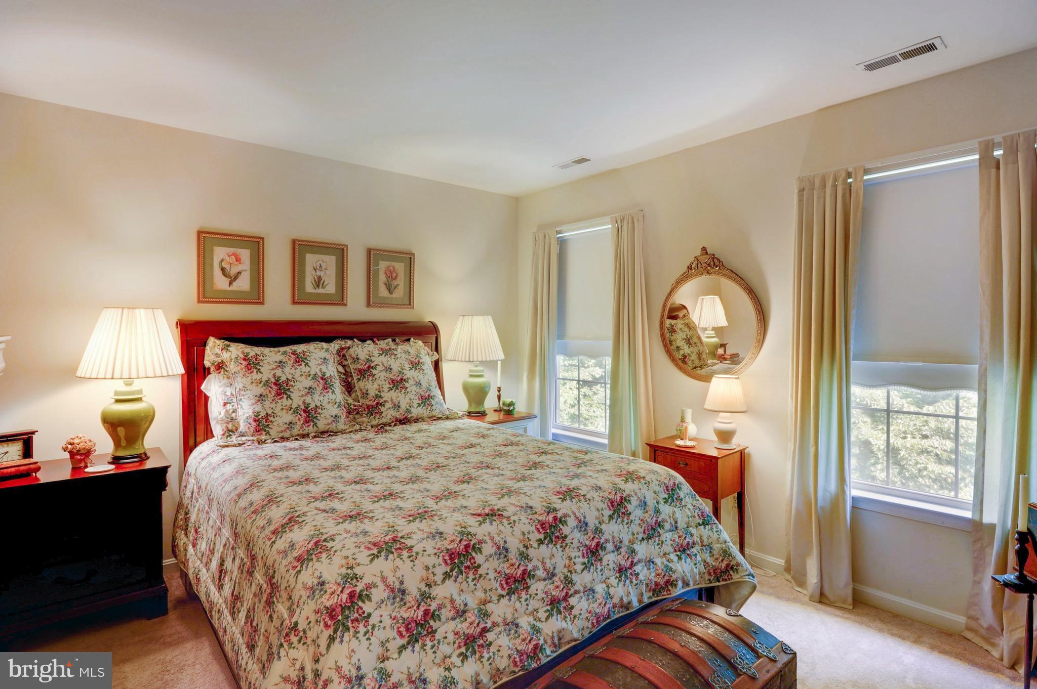 885 Carson Road Huntingtown, MD 20639 - Photo 23 of 30 a bedroom with a large bed and a window