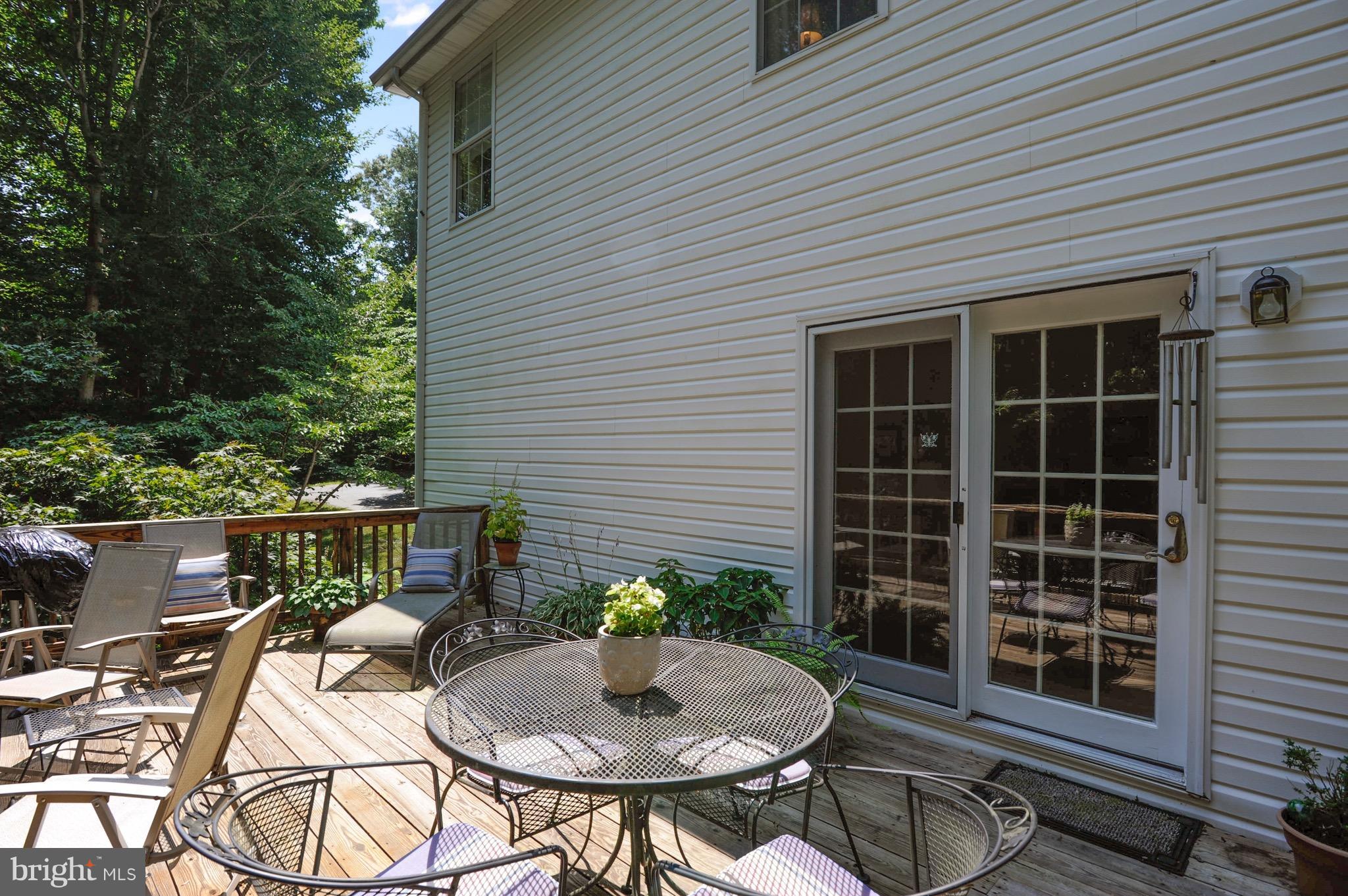 885 Carson Road Huntingtown, MD 20639 - Photo 29 of 30 a backyard of a house with table and chairs
