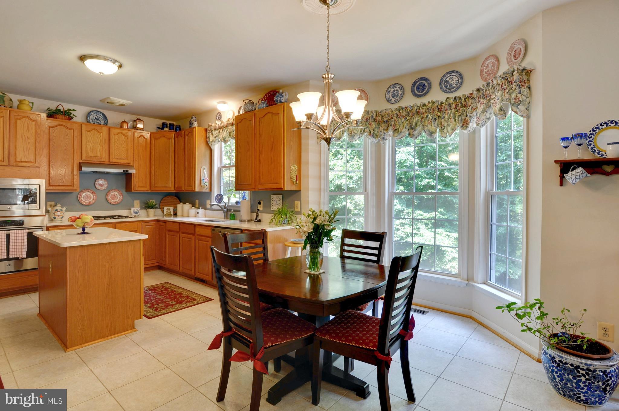 885 Carson Road Huntingtown, MD 20639 - Photo 9 of 30 a dining room filled with furniture and window