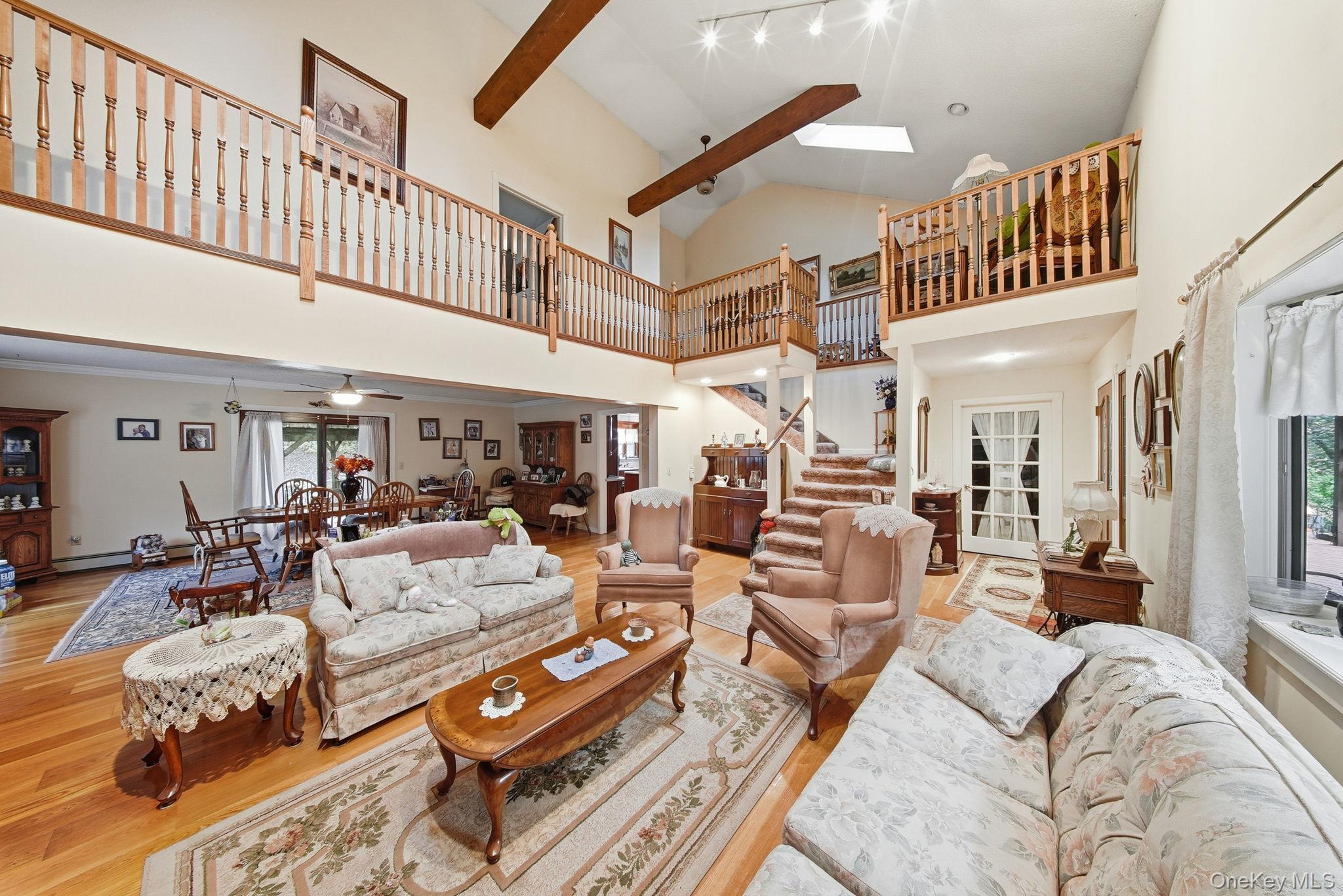 45 Coopers Corners Road Monticello, NY 12701 - Photo 17 of 38 a living room with furniture and a ceiling fan