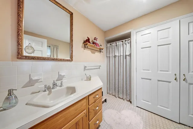 a bathroom with 2 sink and a mirror