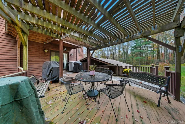 a view of a chairs and table on the deck with wooden floor