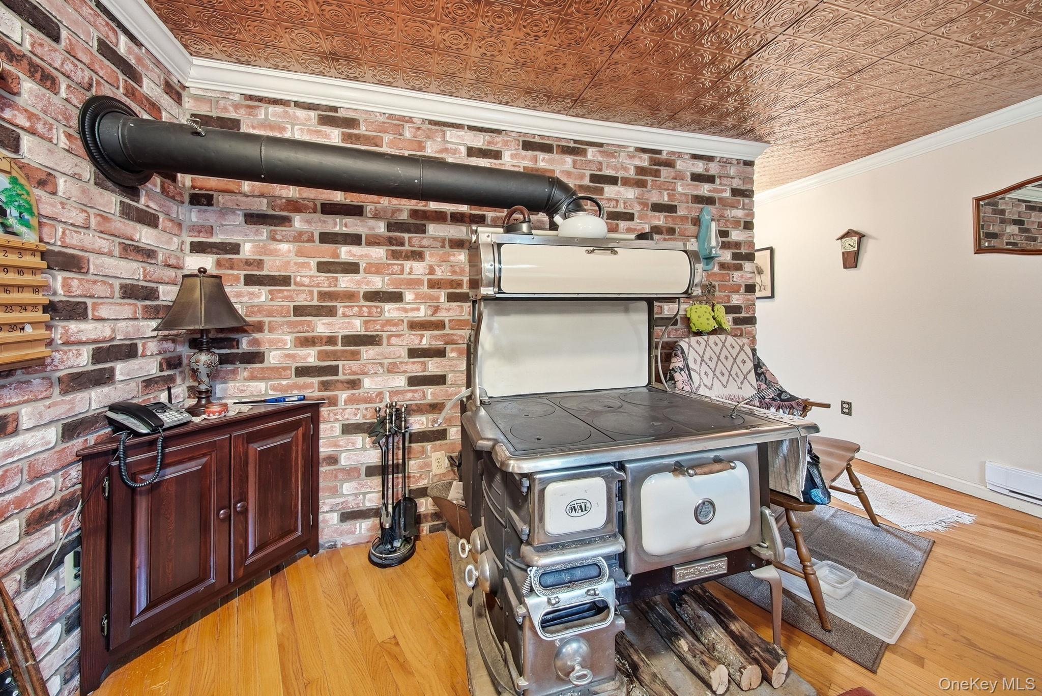 45 Coopers Corners Road Monticello, NY 12701 - Photo 10 of 38 a kitchen with a stove and a microwave