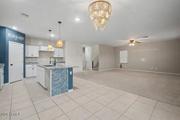 a kitchen with granite countertop cabinets stainless steel appliances and a counter space