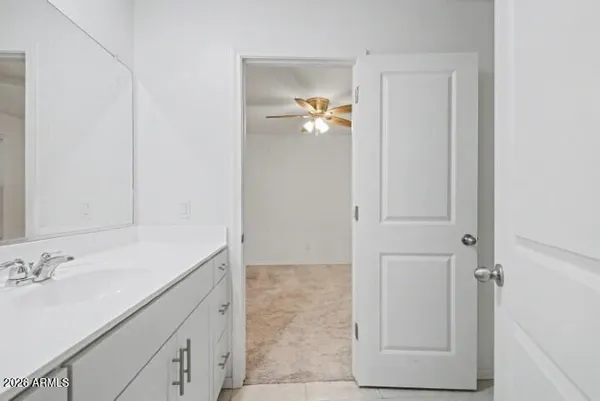 a bathroom with a bathtub shower and toilet