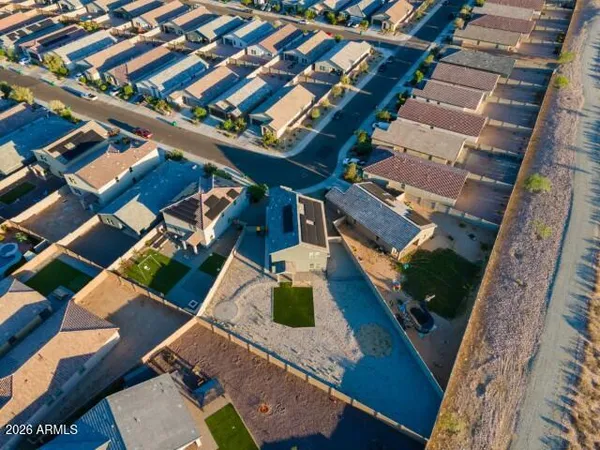 an aerial view of houses with outdoor space