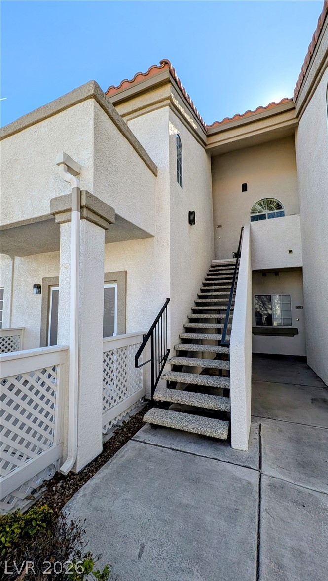 1685 Strasbourg Way, Unit 1685 Henderson, NV 89014 - Photo 1 of 22 Entrance to property featuring a tiled roof and stucco siding
