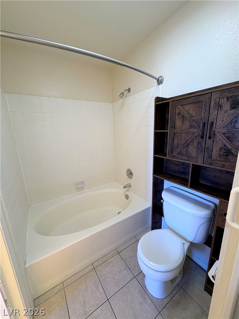 1685 Strasbourg Way, Unit 1685 Henderson, NV 89014 - Photo 19 of 22 Full bathroom featuring light tile patterned flooring and shower / washtub combination