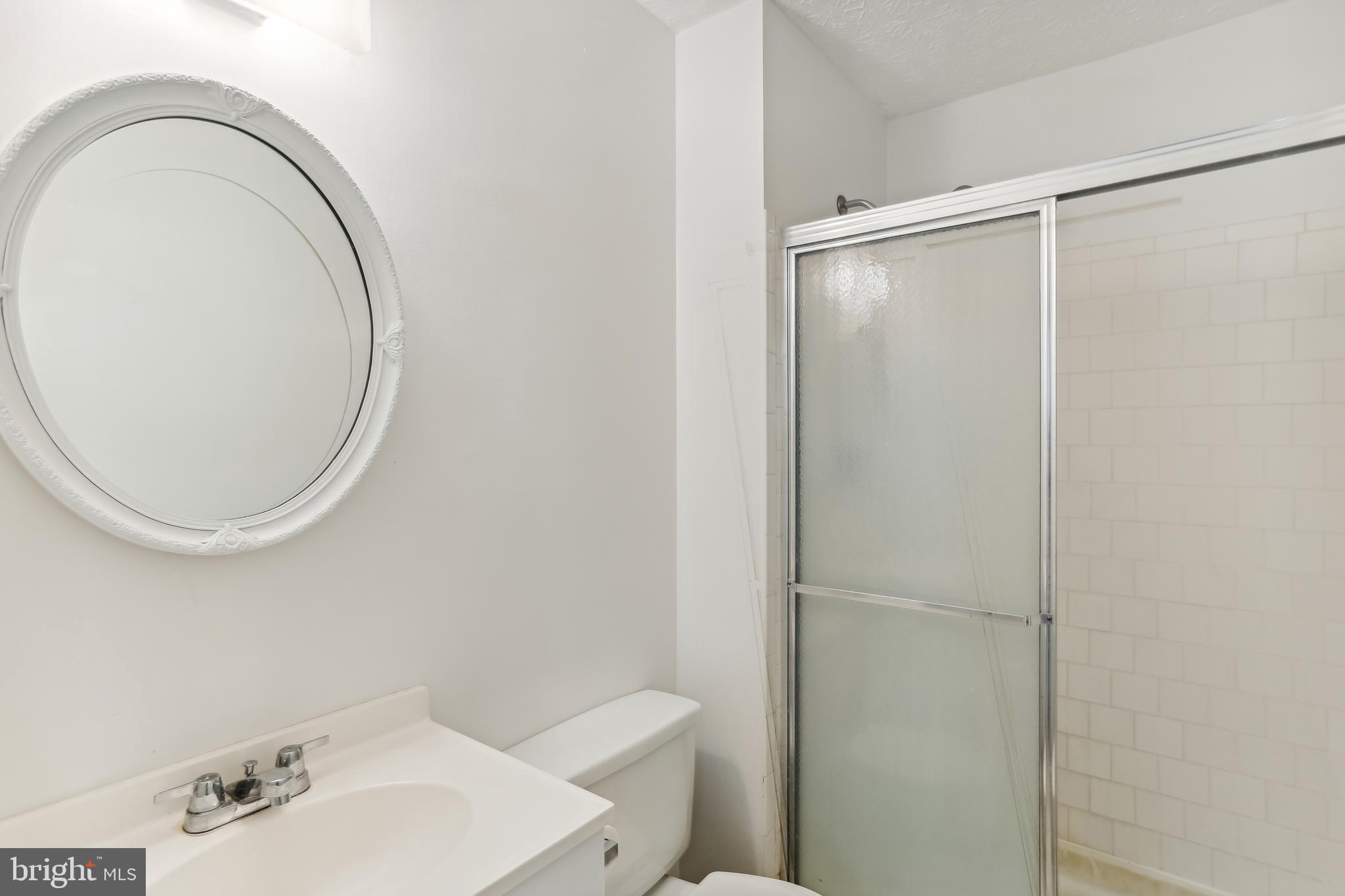 8225 Grainfield Road Severn, MD 21144 - Photo 20 of 35 a bathroom with a sink and a mirror