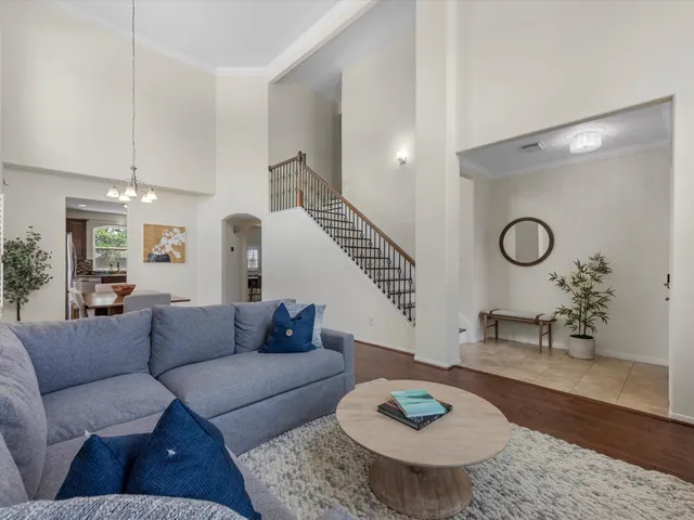 a living room with furniture and a rug