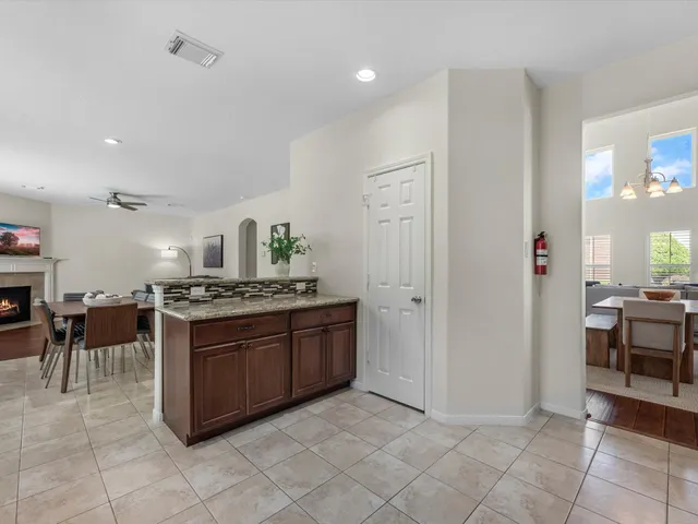 a kitchen with stainless steel appliances granite countertop a stove and a sink