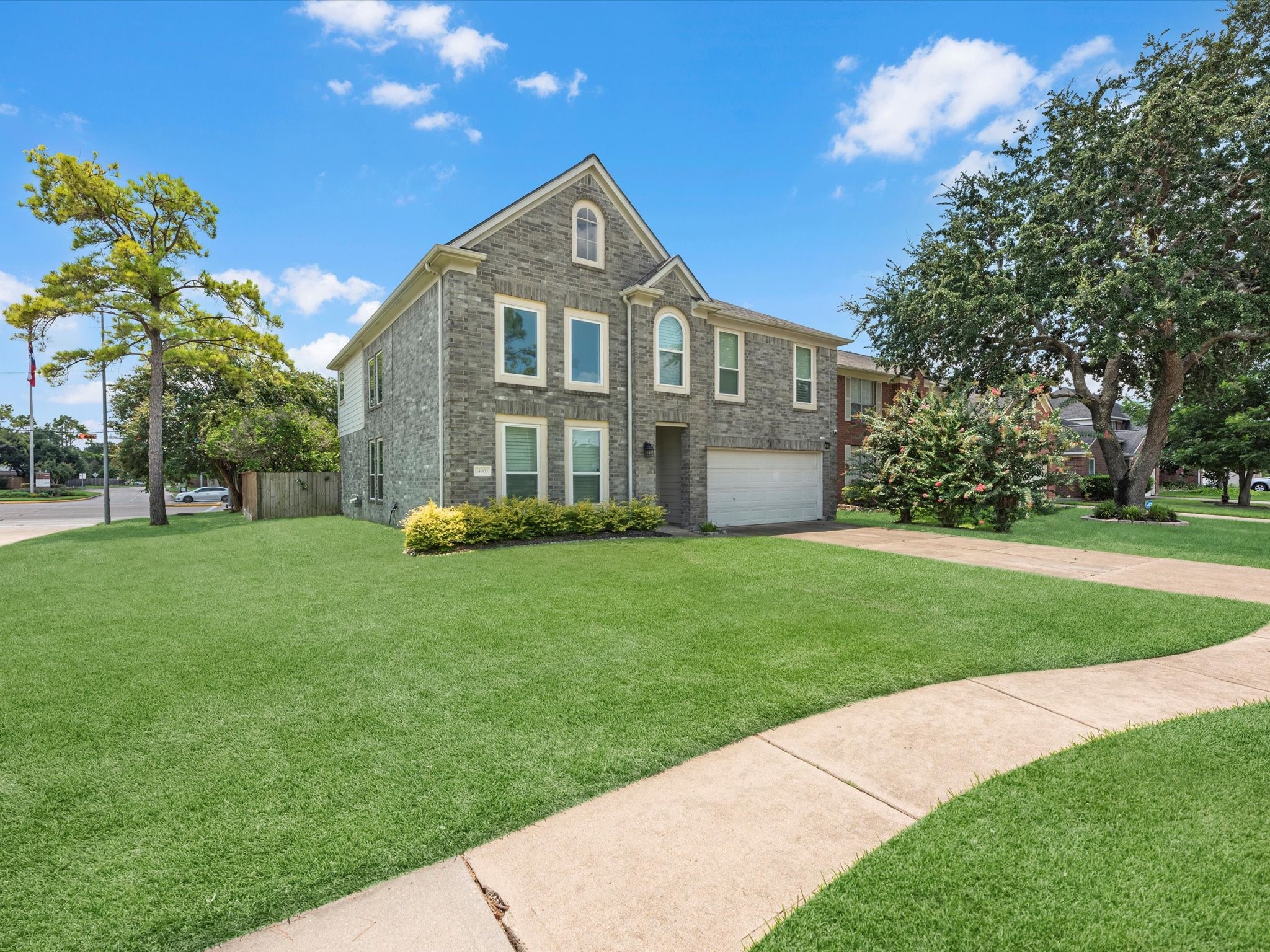 14003 Stardust Lane Houston, TX 77041 - Photo 2 of 30 a front view of a house with a yard