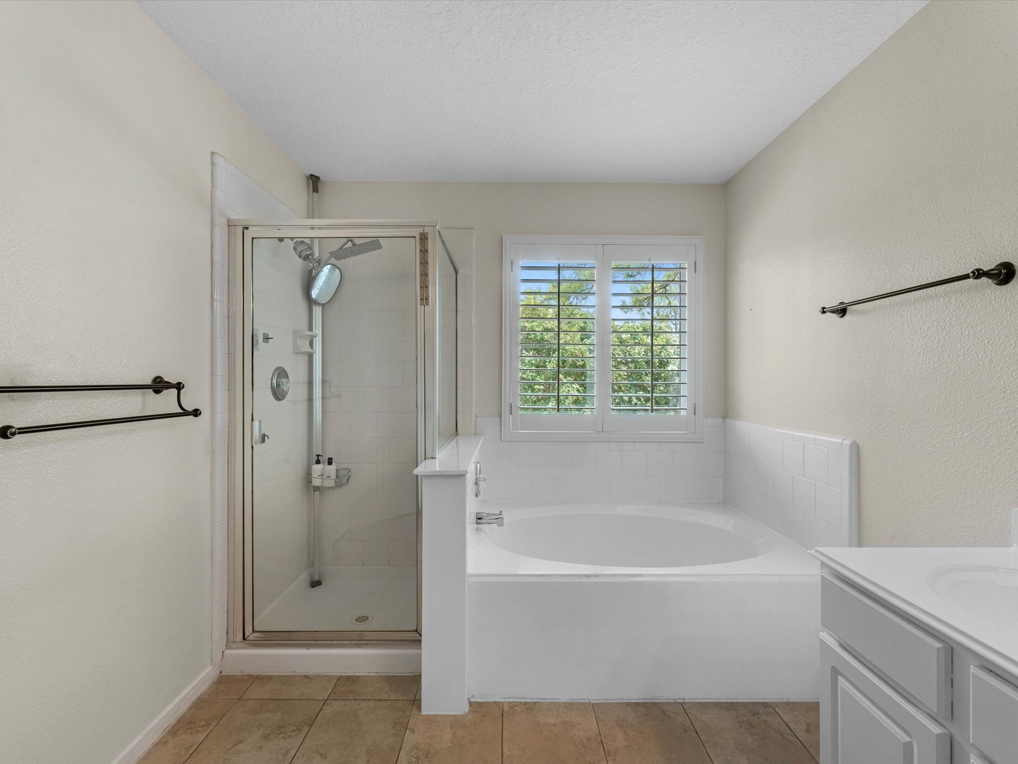 14003 Stardust Lane Houston, TX 77041 - Photo 22 of 30 a white bath tub sitting next to a shower