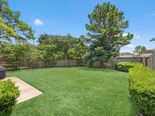 a view of a backyard with a garden