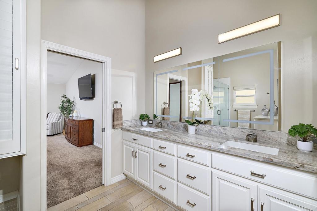4235 Harrison Street Carlsbad, CA 92008 - Photo 25 of 55 a bathroom with a granite countertop sink and a mirror