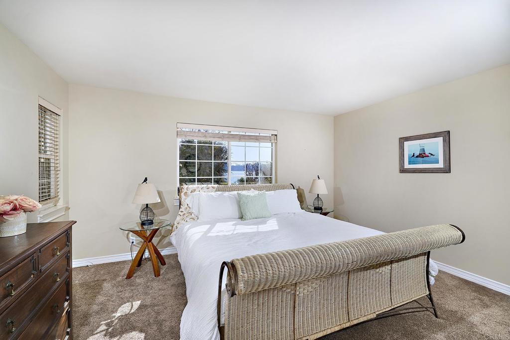 4235 Harrison Street Carlsbad, CA 92008 - Photo 29 of 55 a bedroom with a bed and a table in it