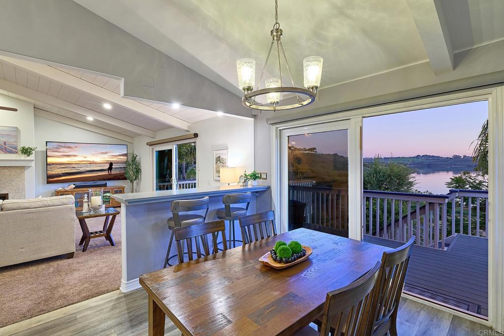 4235 Harrison Street Carlsbad, CA 92008 - Photo 45 of 55 a view of a dining room with furniture window and wooden floor