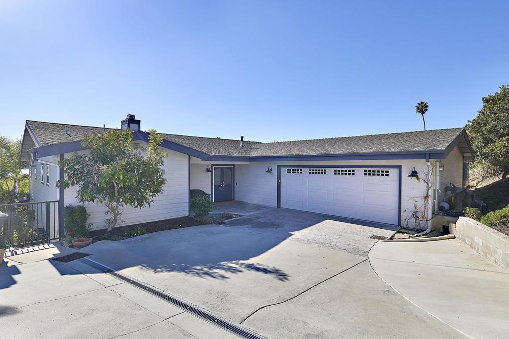 4235 Harrison Street Carlsbad, CA 92008 - Photo 53 of 55 a front view of a house with a yard