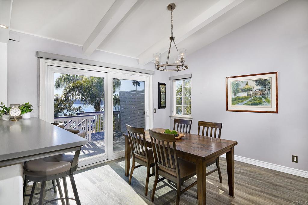 4235 Harrison Street Carlsbad, CA 92008 - Photo 8 of 55 a view of a dining room with furniture window and wooden floor