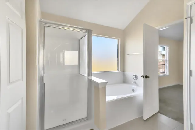 a bathroom with a bathtub and a sink