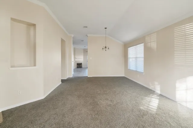 a view of empty room with windows