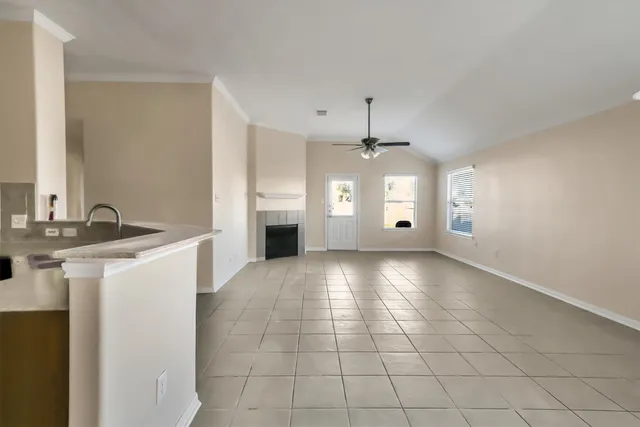 a view of a kitchen with a sink and a stove top oven