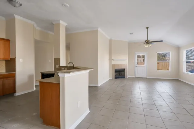 a view of a kitchen with a sink and a stove top oven