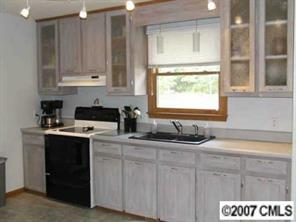 36627 Finger Road Mount Pleasant, NC 28124 - Photo 2 of 8 a kitchen with stainless steel appliances granite countertop a sink stove and cabinets