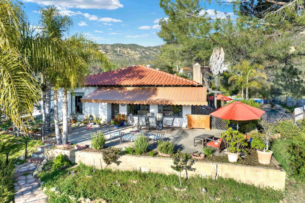 an outdoor space with patio and umbrella
