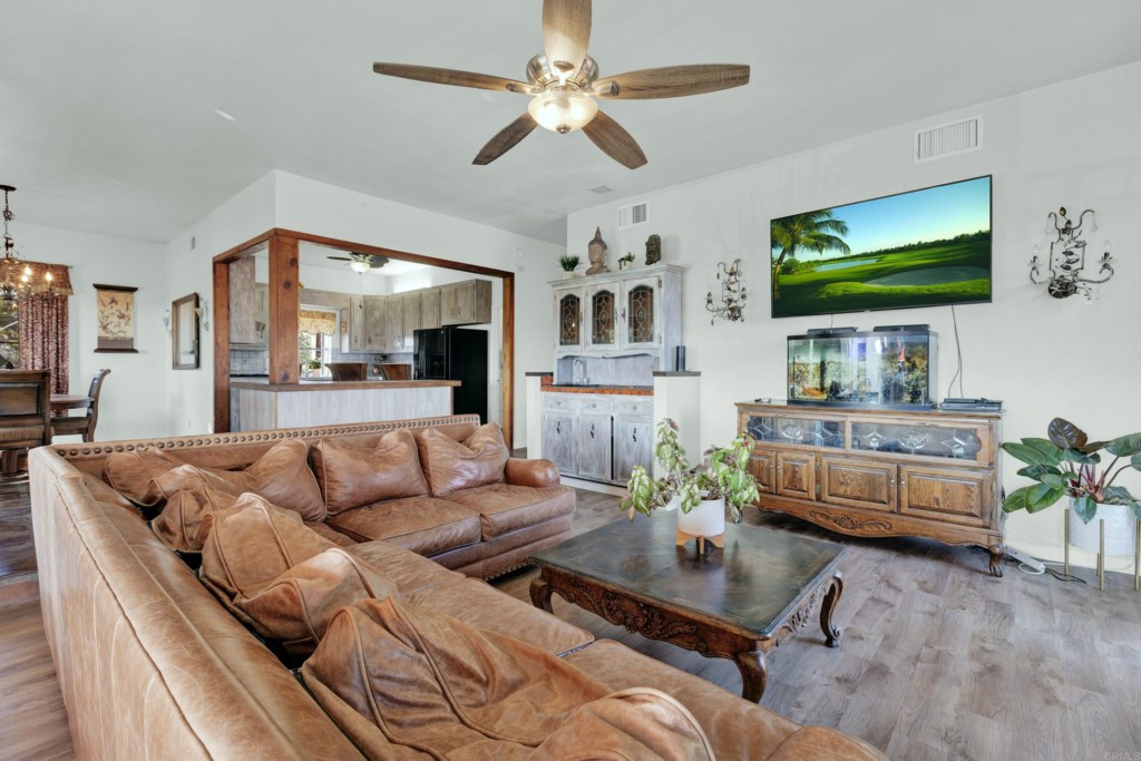 15866 Lyons Valley Road Jamul, CA 91935 - Photo 14 of 56 a living room with furniture and a flat screen tv