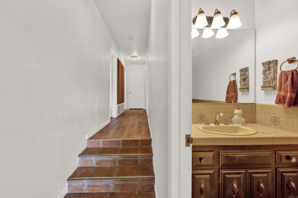 15866 Lyons Valley Road Jamul, CA 91935 - Photo 19 of 56 a en suite bathroom with a sink and a mirror