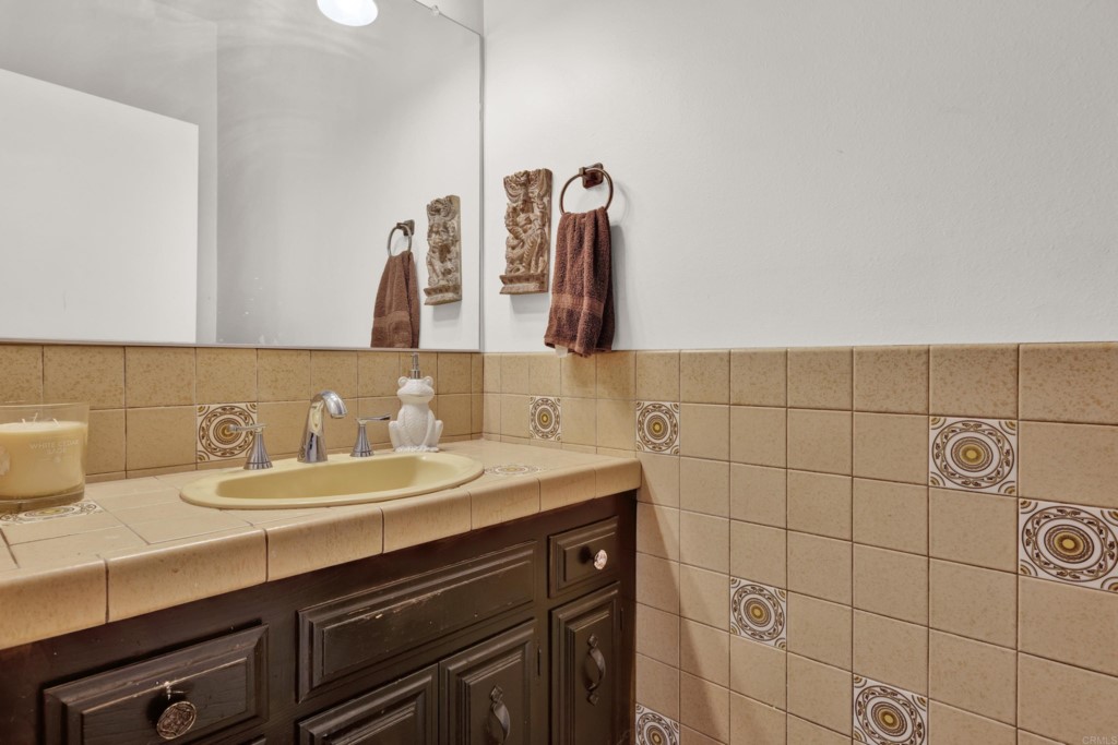 15866 Lyons Valley Road Jamul, CA 91935 - Photo 20 of 56 a bathroom with a sink and a mirror