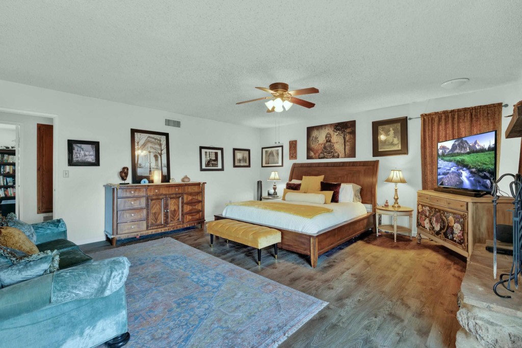 15866 Lyons Valley Road Jamul, CA 91935 - Photo 22 of 56 a living room with furniture and flat screen tv
