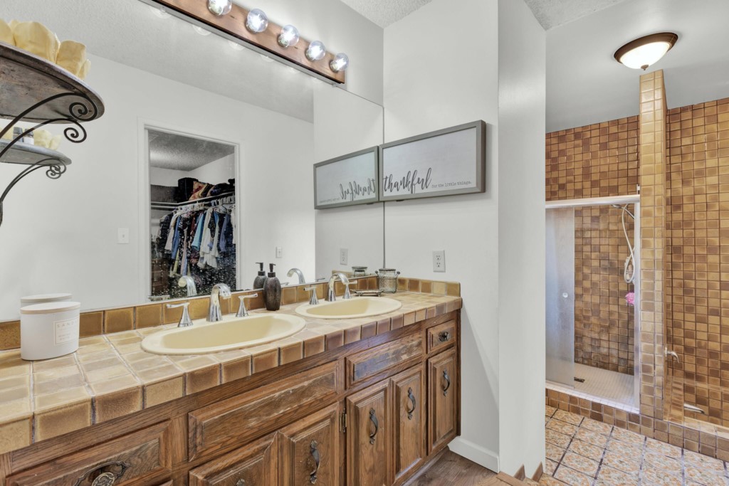 15866 Lyons Valley Road Jamul, CA 91935 - Photo 23 of 56 a bathroom with a sink double vanity and a mirror