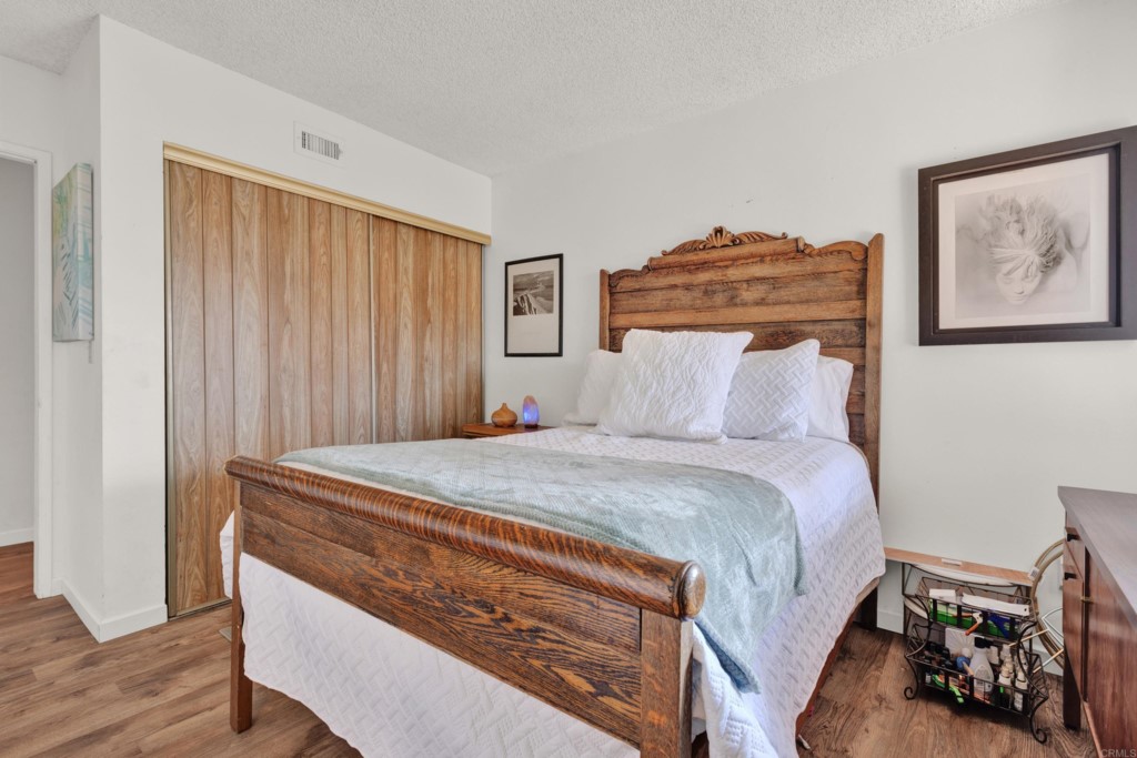 15866 Lyons Valley Road Jamul, CA 91935 - Photo 29 of 56 a bedroom with a bed and a painting on the wall