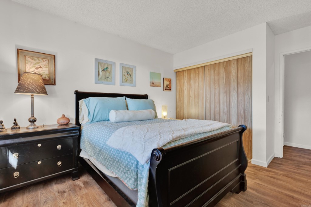 15866 Lyons Valley Road Jamul, CA 91935 - Photo 31 of 56 a bedroom with a bed and a night stand