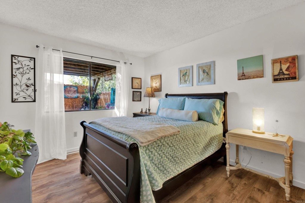 15866 Lyons Valley Road Jamul, CA 91935 - Photo 32 of 56 a bedroom with a bed and a table