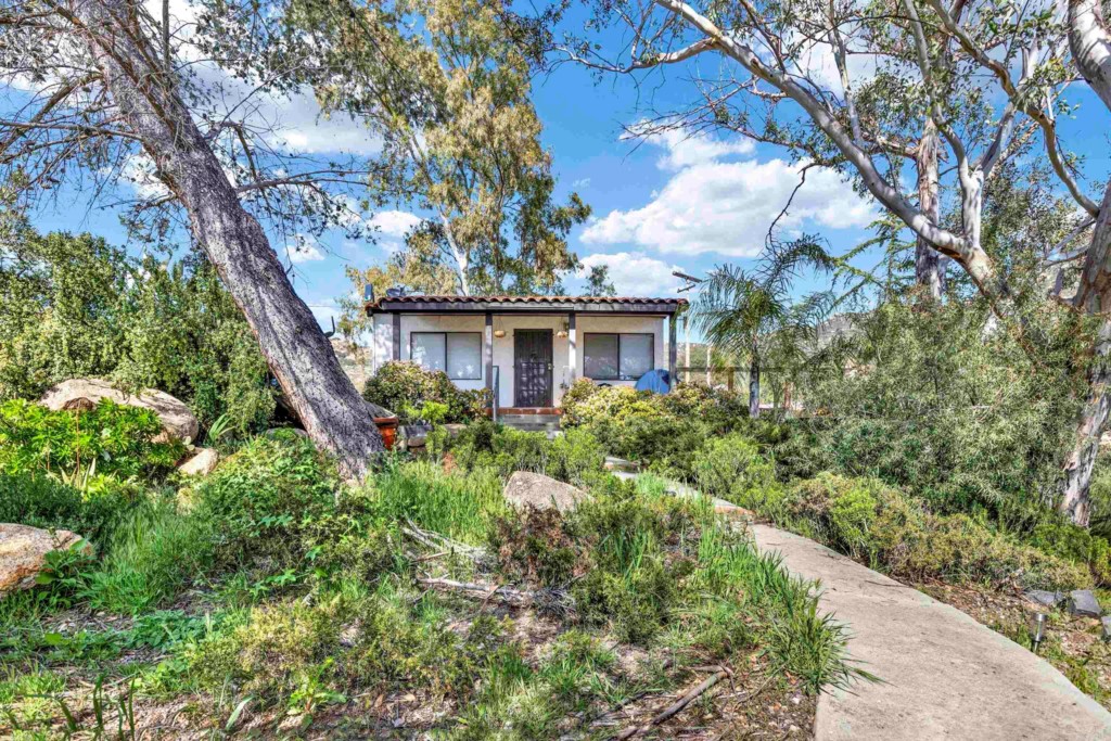 15866 Lyons Valley Road Jamul, CA 91935 - Photo 39 of 56 a view of a house with a tree and plants