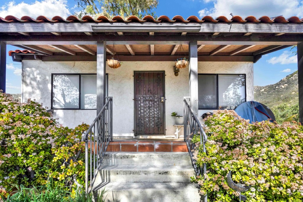 15866 Lyons Valley Road Jamul, CA 91935 - Photo 40 of 56 a front view of a house with a yard