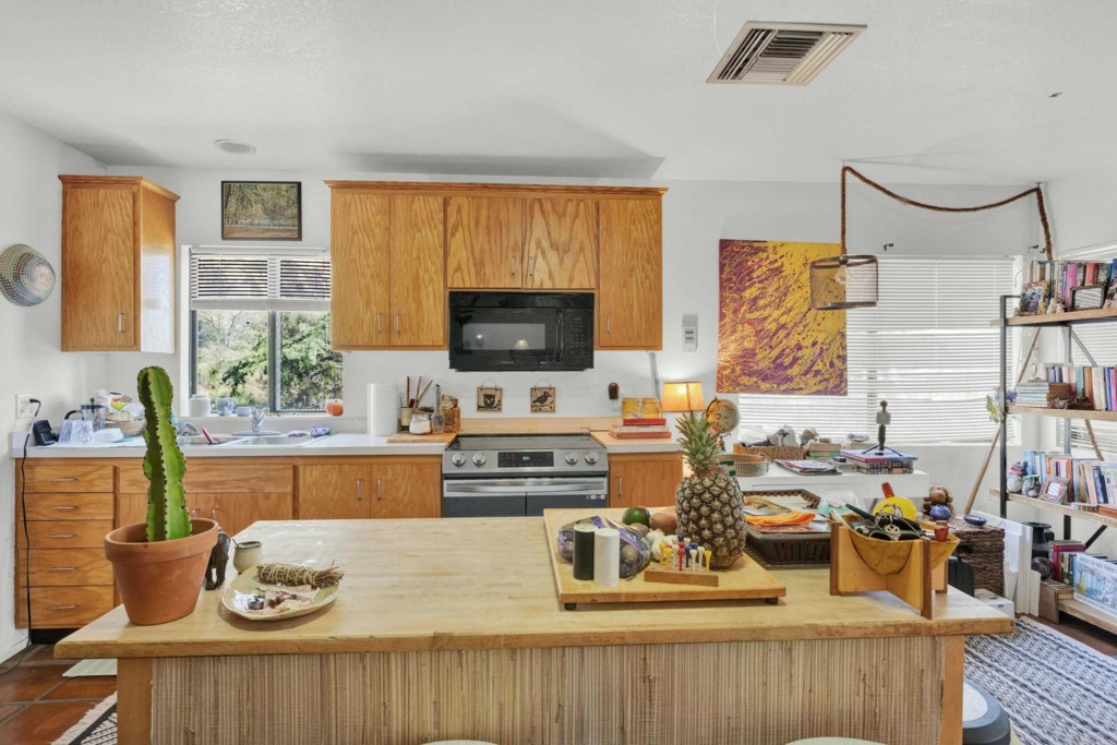 15866 Lyons Valley Road Jamul, CA 91935 - Photo 43 of 56 a living room with furniture and a flat screen tv