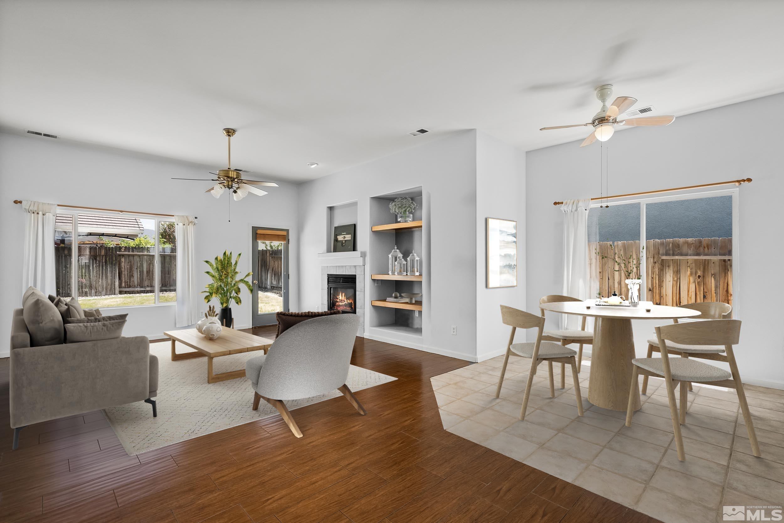 10160 Buckeye Court Reno, NV 89521 - Photo 2 of 36 a dining room with wooden floor a chandelier a glass table and chairs