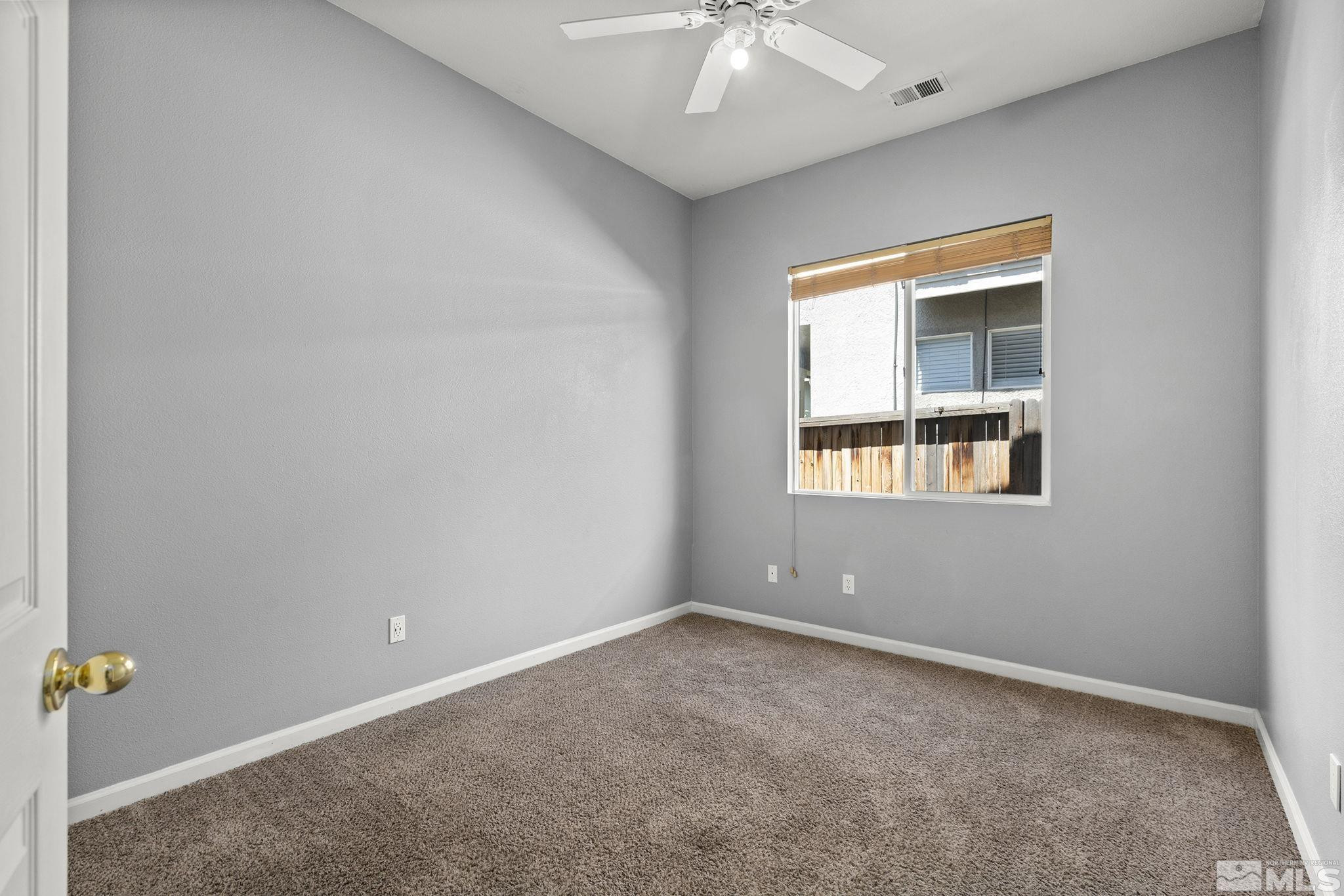 10160 Buckeye Court Reno, NV 89521 - Photo 21 of 36 an empty room with windows