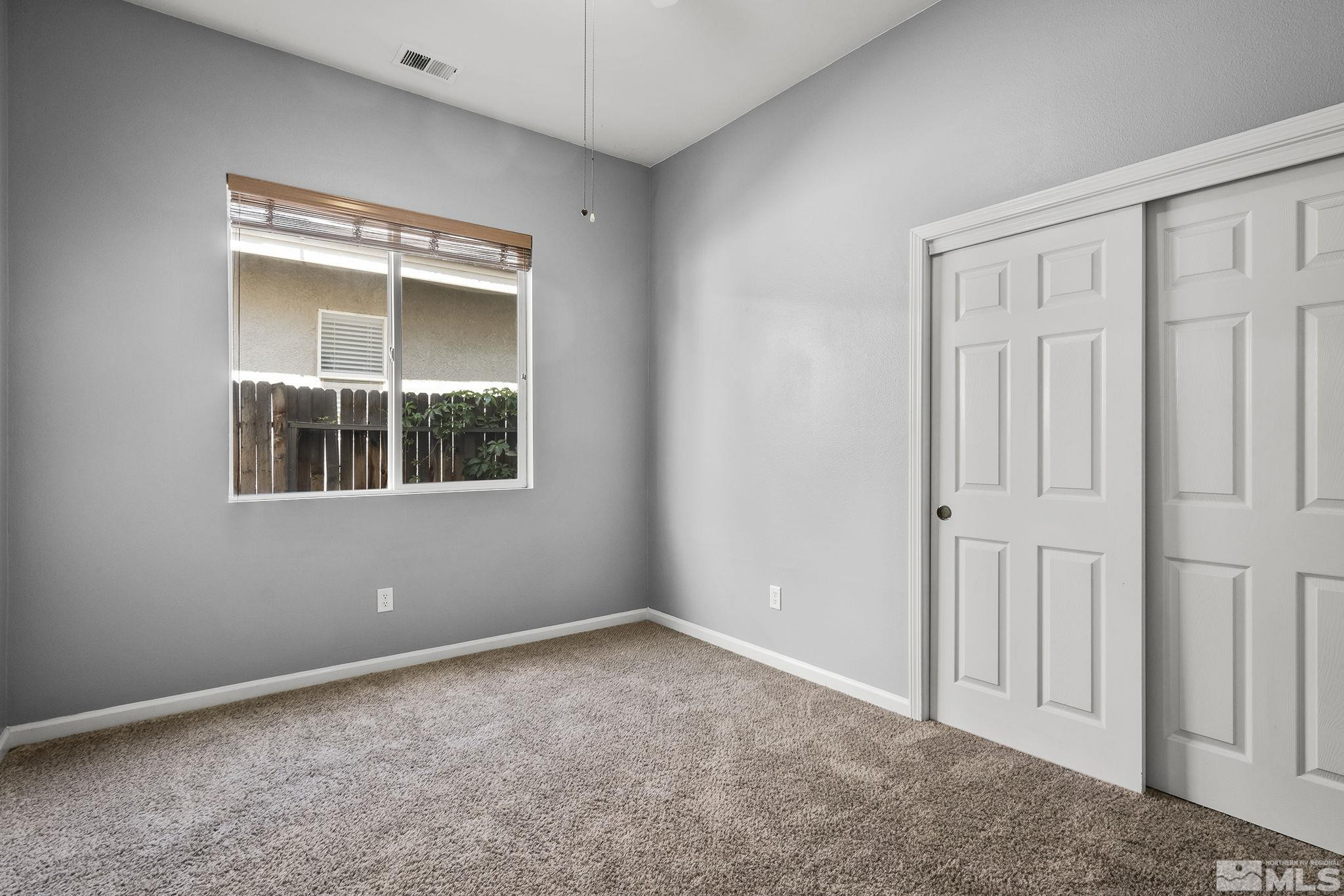 10160 Buckeye Court Reno, NV 89521 - Photo 22 of 36 an empty room with a window
