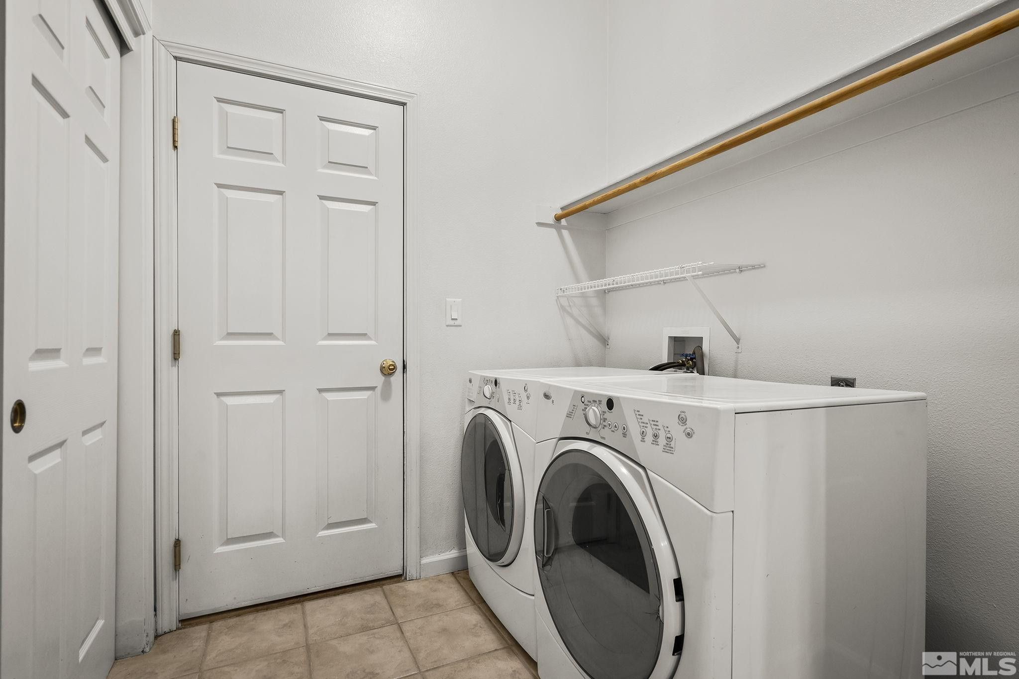 10160 Buckeye Court Reno, NV 89521 - Photo 24 of 36 a view of storage and utility room with washer and dryer
