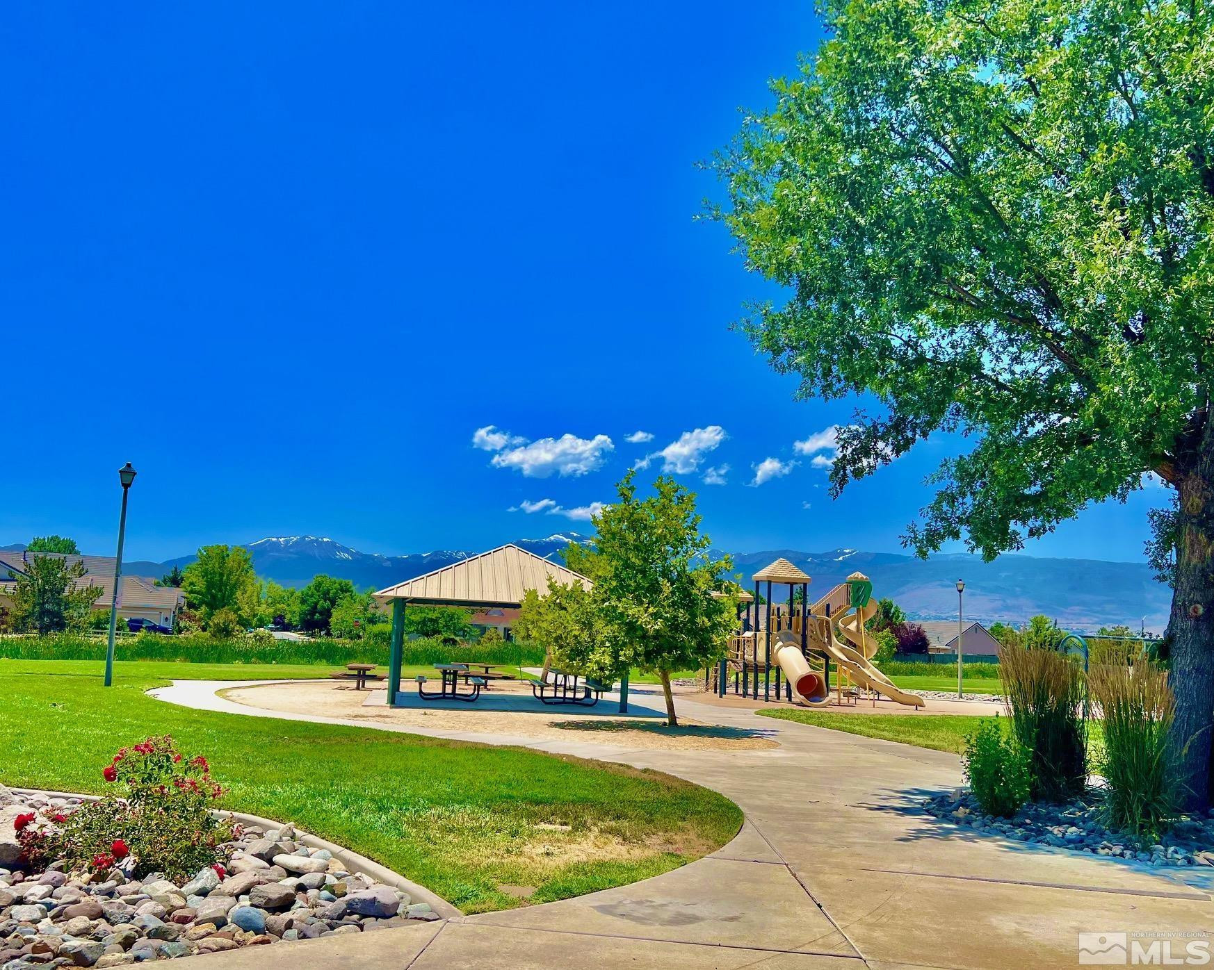10160 Buckeye Court Reno, NV 89521 - Photo 31 of 36 a view of a garden with a building in the background