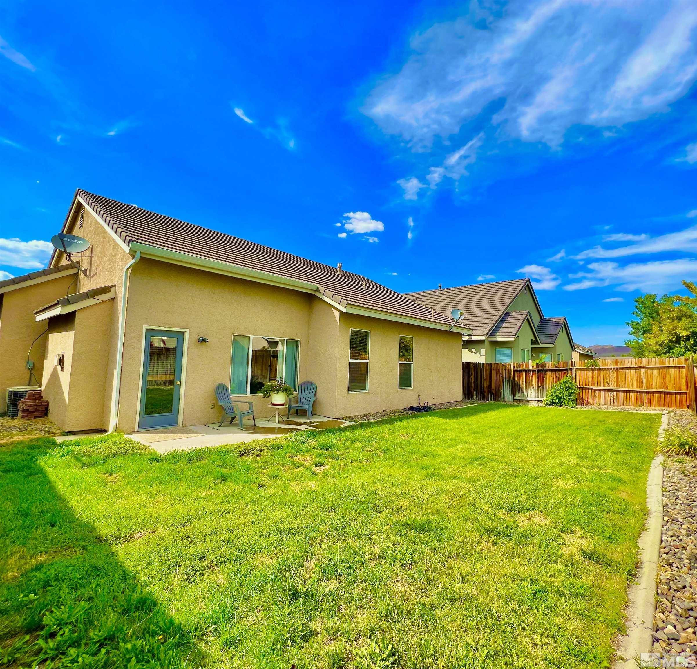 10160 Buckeye Court Reno, NV 89521 - Photo 35 of 36 a view of a house with a yard