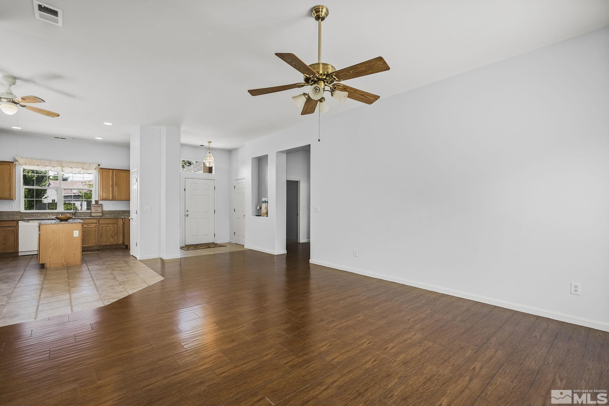 10160 Buckeye Court Reno, NV 89521 - Photo 7 of 36 a view of empty room with wooden floor