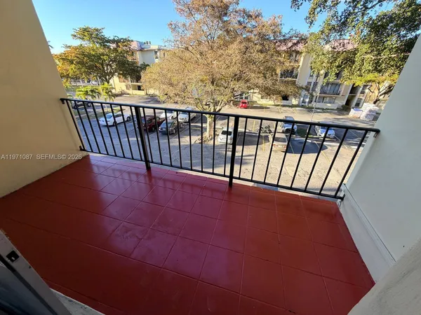 a view of a balcony with wooden floor